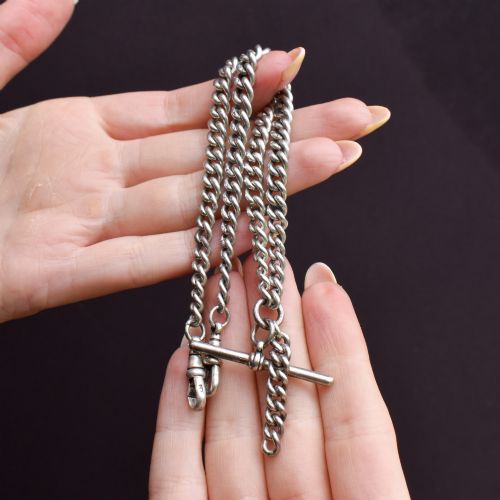 fig 1. A sterling silver curb link double Albert pocket watch chain featuring a central T-bar.