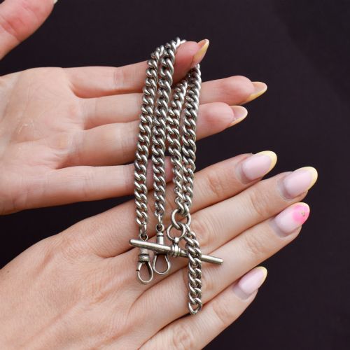 fig 2. A sterling silver curb link double Albert pocket watch chain featuring a central T-bar.