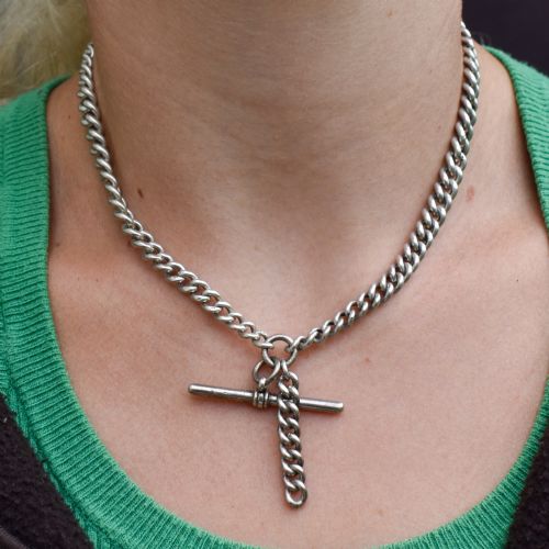 fig 3. A sterling silver curb link double Albert pocket watch chain featuring a central T-bar.