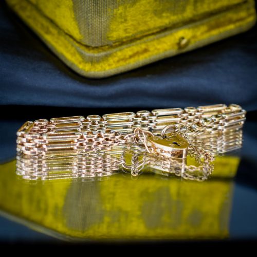 fig 2. An antique rolled gold gate link bracelet featuring an engraved heart-shaped padlock clasp and safety chain.