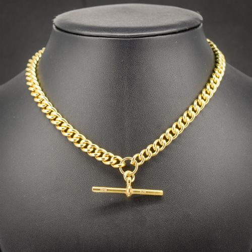 fig 1. An antique gold-gilded sterling silver Albert watch chain featuring uniform curb links, a T-bar attachment, and dual swivel clasps.