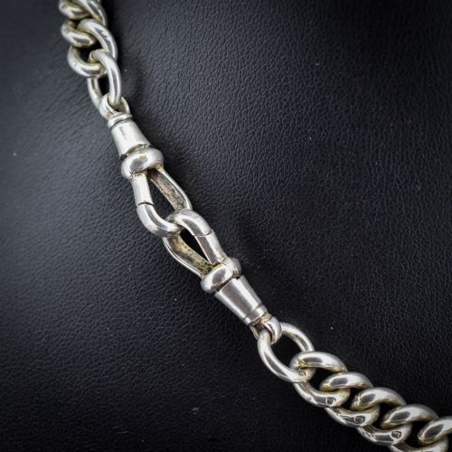 fig 3. An antique sterling silver Albert watch chain featuring heavy curb links, double swivel clasps, and a central T-bar attachment.