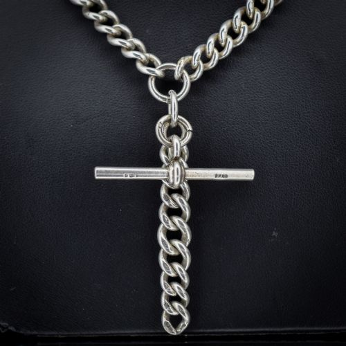 fig 2. An antique sterling silver curb link Albert chain featuring a central T-bar attachment and double dog clip clasps.