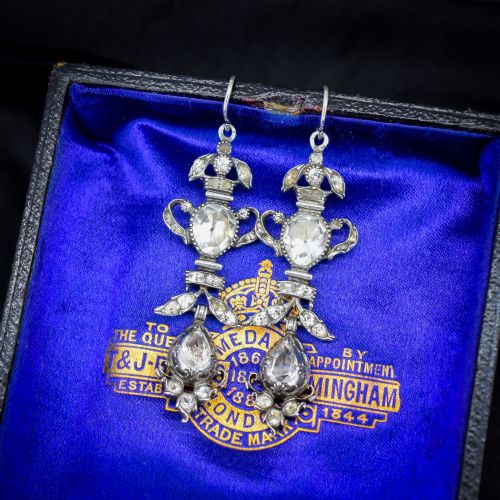 fig 2. Pair of Georgian silver drop earrings featuring faceted clear rock crystal stones set into articulated silver mounts inside a velvet box.