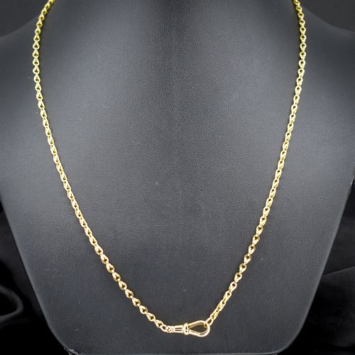 fig 1. An antique yellow gold twenty-inch chain necklace featuring love knot links and a functional swivel dog clip fastener.