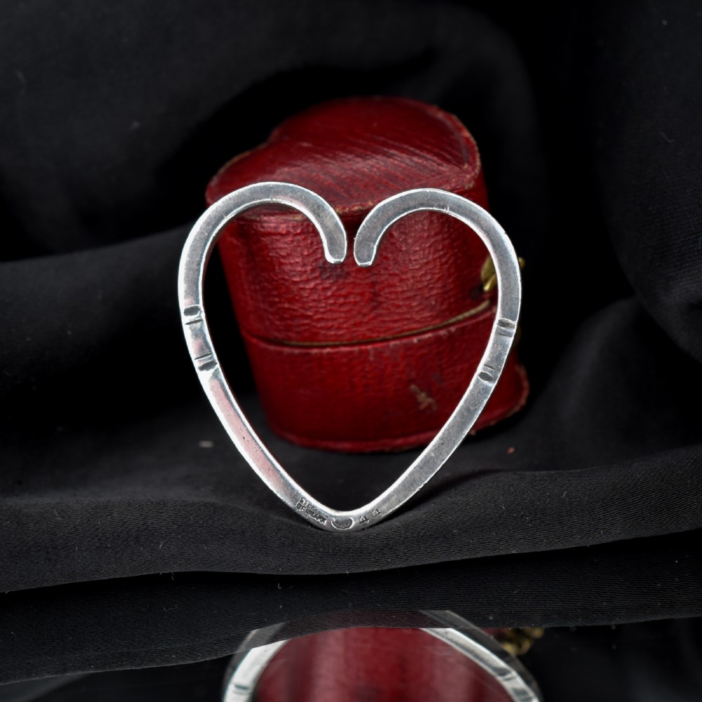 A vintage Georg Jensen open heart-shaped sterling silver keyring stamped with Danish maker hallmarks.