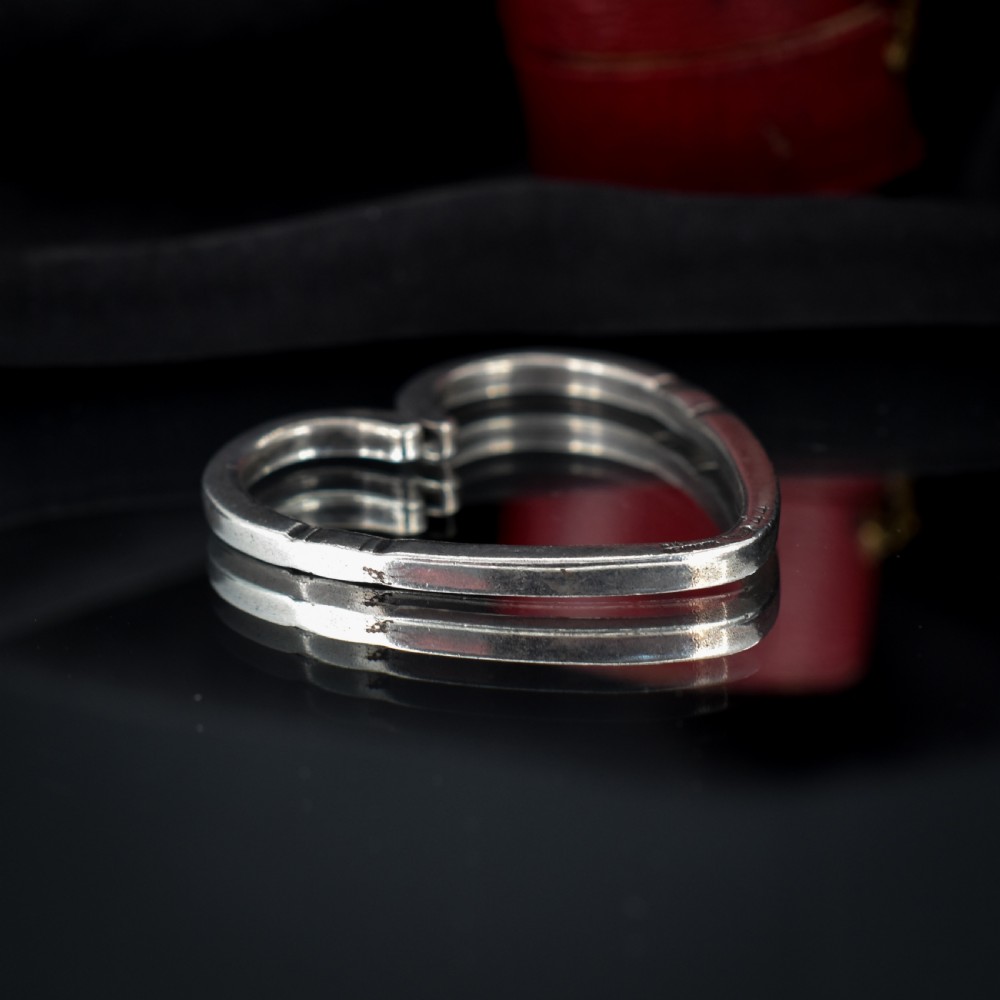 A vintage Georg Jensen open heart-shaped sterling silver keyring stamped with Danish maker hallmarks. View III