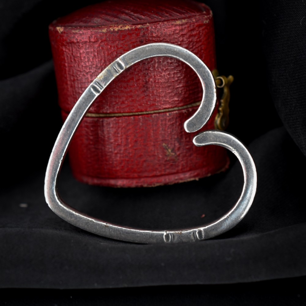 A vintage Georg Jensen open heart-shaped sterling silver keyring stamped with Danish maker hallmarks. View VI