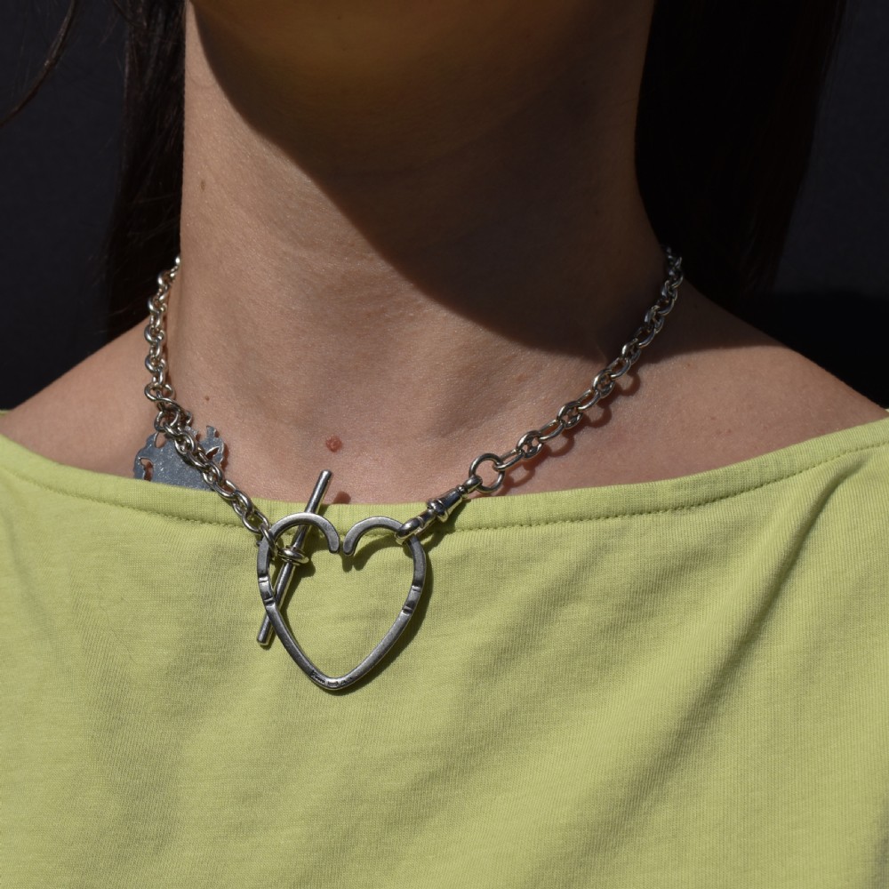 A vintage Georg Jensen open heart-shaped sterling silver keyring stamped with Danish maker hallmarks. View IX