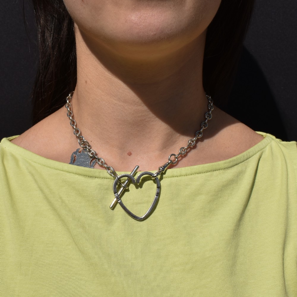 A vintage Georg Jensen open heart-shaped sterling silver keyring stamped with Danish maker hallmarks. View X