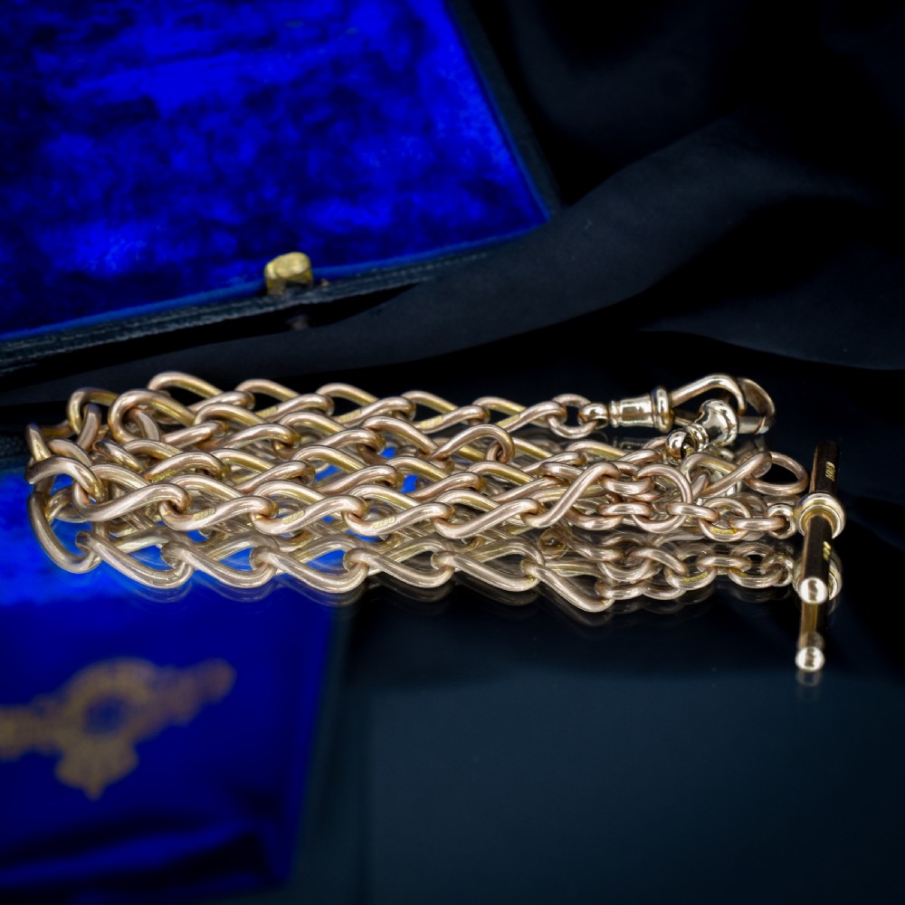 An antique 9ct gold Albert watch chain featuring oval links, a central T-bar, and double dog clip clasps. View III