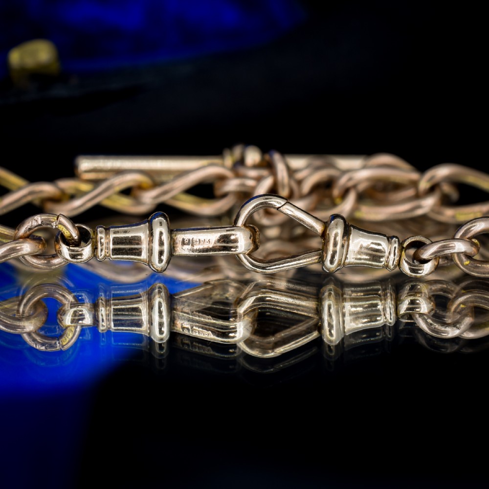 An antique 9ct gold Albert watch chain featuring oval links, a central T-bar, and double dog clip clasps. View VI