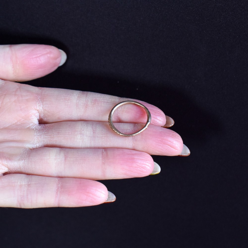 A Georgian 9ct gold split ring with hand-engraved serpent Ouroboros details. View VI