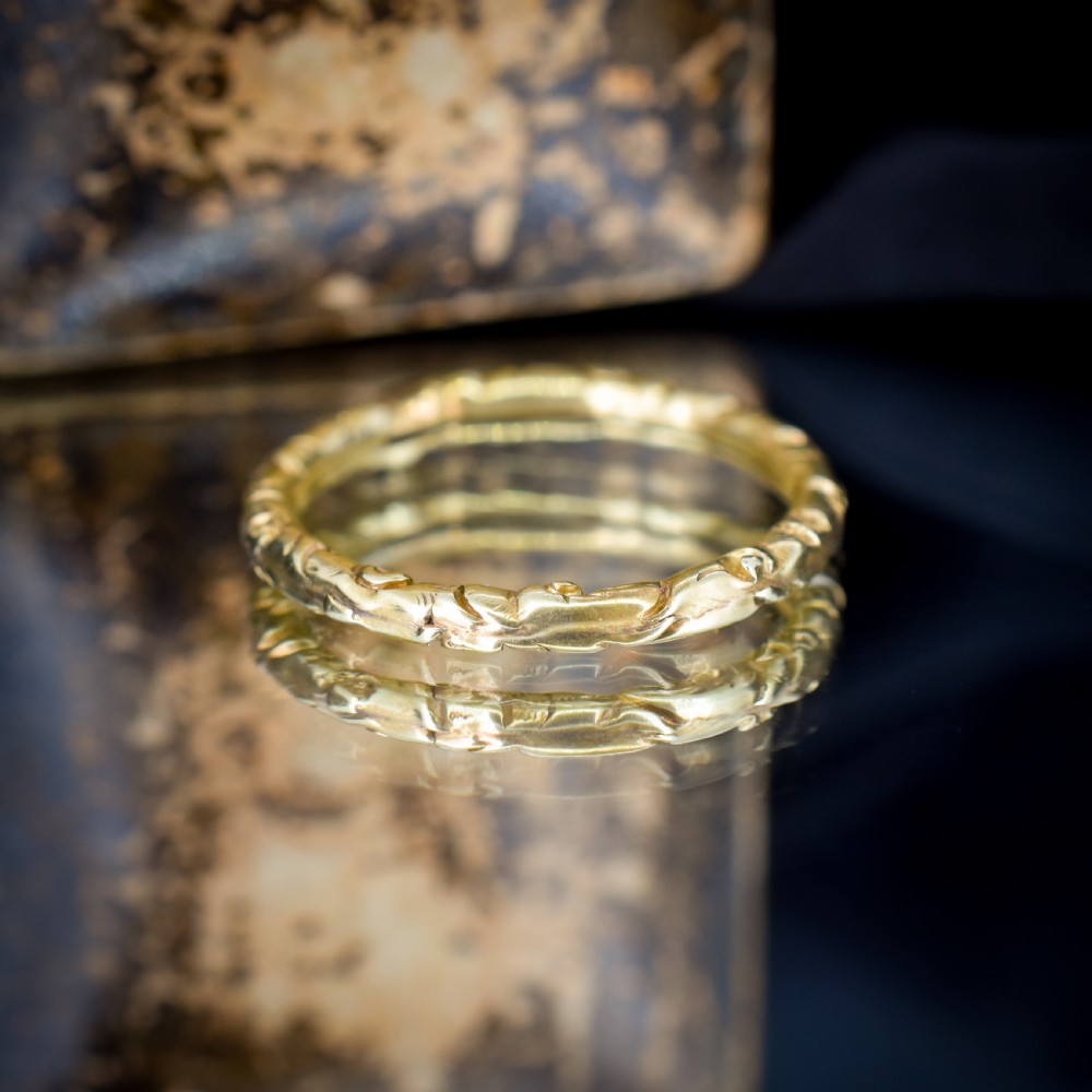 A circular Georgian 12ct yellow gold split ring featuring hand-engraved scrollwork around the outer edge. View XI