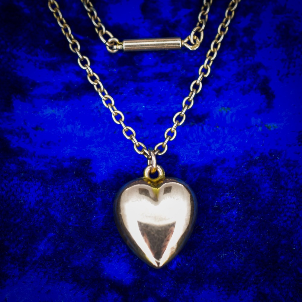 An antique 9ct yellow gold chain necklace with a smooth puffed heart pendant. View VIII