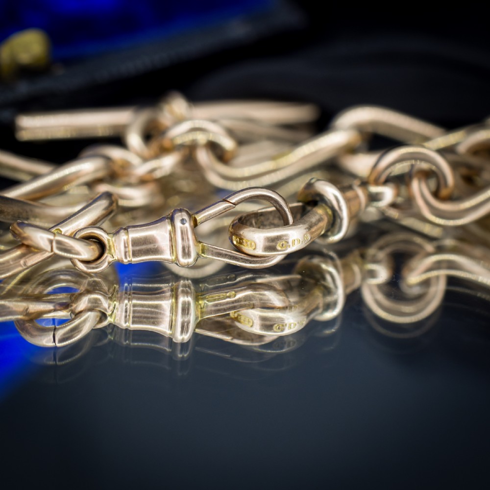 An antique 9ct yellow gold Albert watch chain necklace featuring polished oval links and a central suspended T-bar pendant. View X