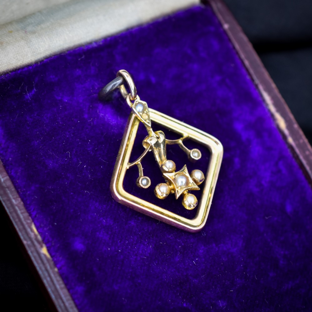An antique 9ct yellow gold openwork lozenge-shaped pendant set with seed pearls. View IV