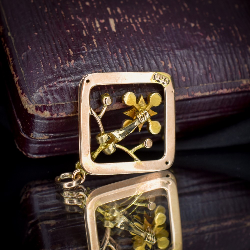 An antique 9ct yellow gold openwork lozenge-shaped pendant set with seed pearls. View VIII