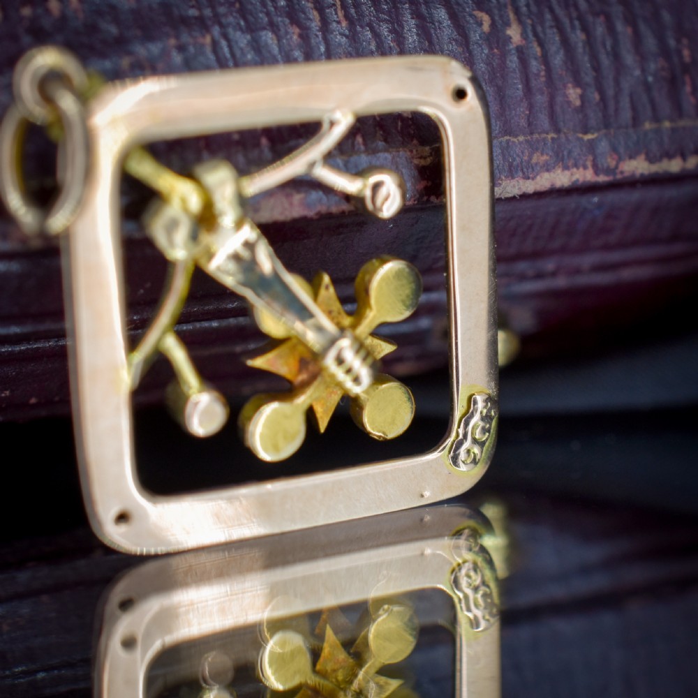 An antique 9ct yellow gold openwork lozenge-shaped pendant set with seed pearls. View IX