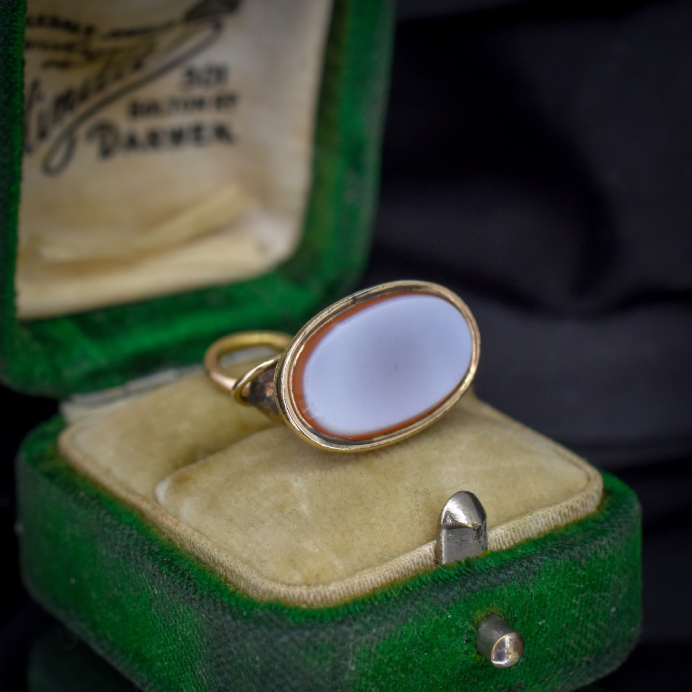 An antique gold fob seal featuring a three-dimensional standing lion figure on an engraved oval base set with a sardonyx stone. View III