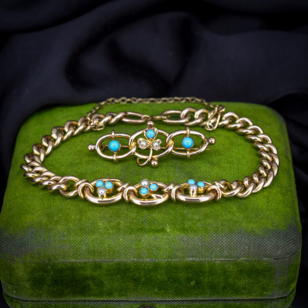 An antique rolled gold jewellery set featuring a curb link bracelet with turquoise and pearl embellishments alongside a matching bar brooch. View VI