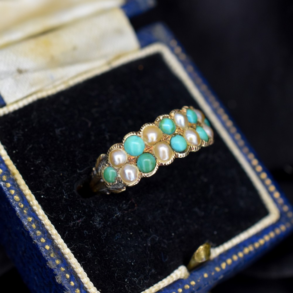 An antique Victorian 12ct gold double row ring set with alternating turquoise cabochons and natural pearls. View IV