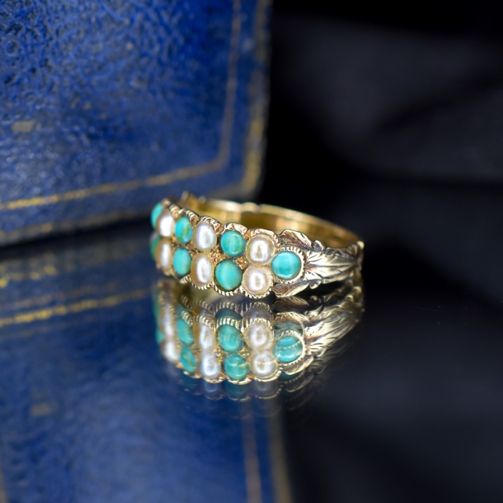 An antique Victorian 12ct gold double row ring set with alternating turquoise cabochons and natural pearls. View VI