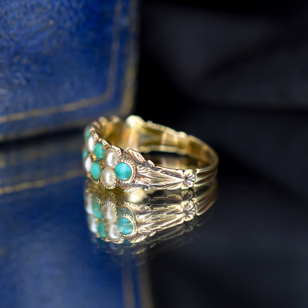 An antique Victorian 12ct gold double row ring set with alternating turquoise cabochons and natural pearls. View VII