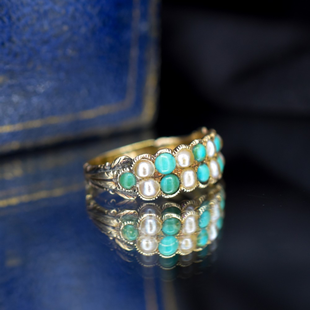 An antique Victorian 12ct gold double row ring set with alternating turquoise cabochons and natural pearls. View IX