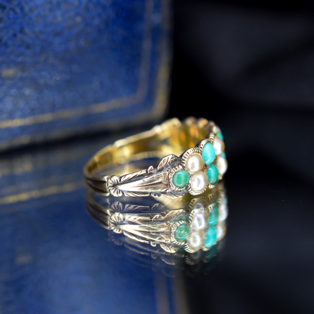 An antique Victorian 12ct gold double row ring set with alternating turquoise cabochons and natural pearls. View X