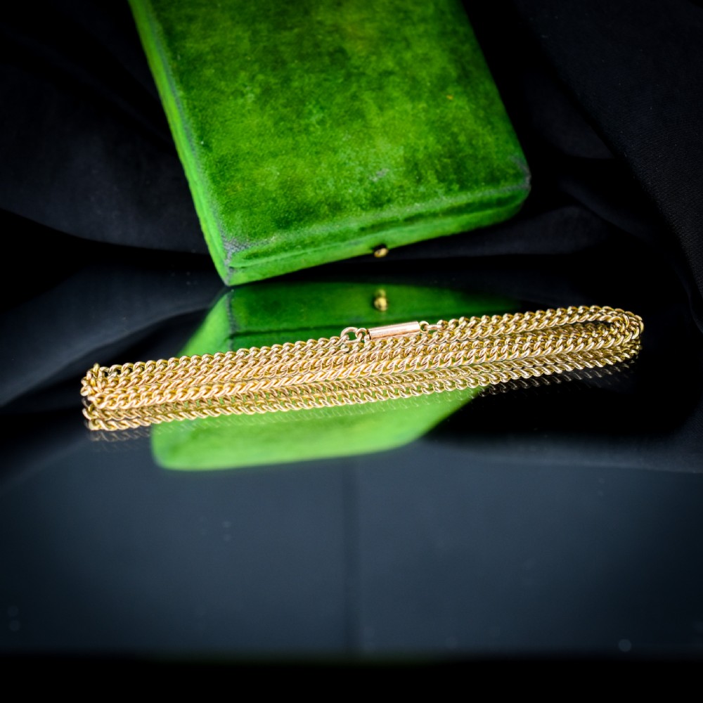 An antique 9ct yellow gold flat curb link chain necklace featuring a cylindrical barrel clasp. View VIII