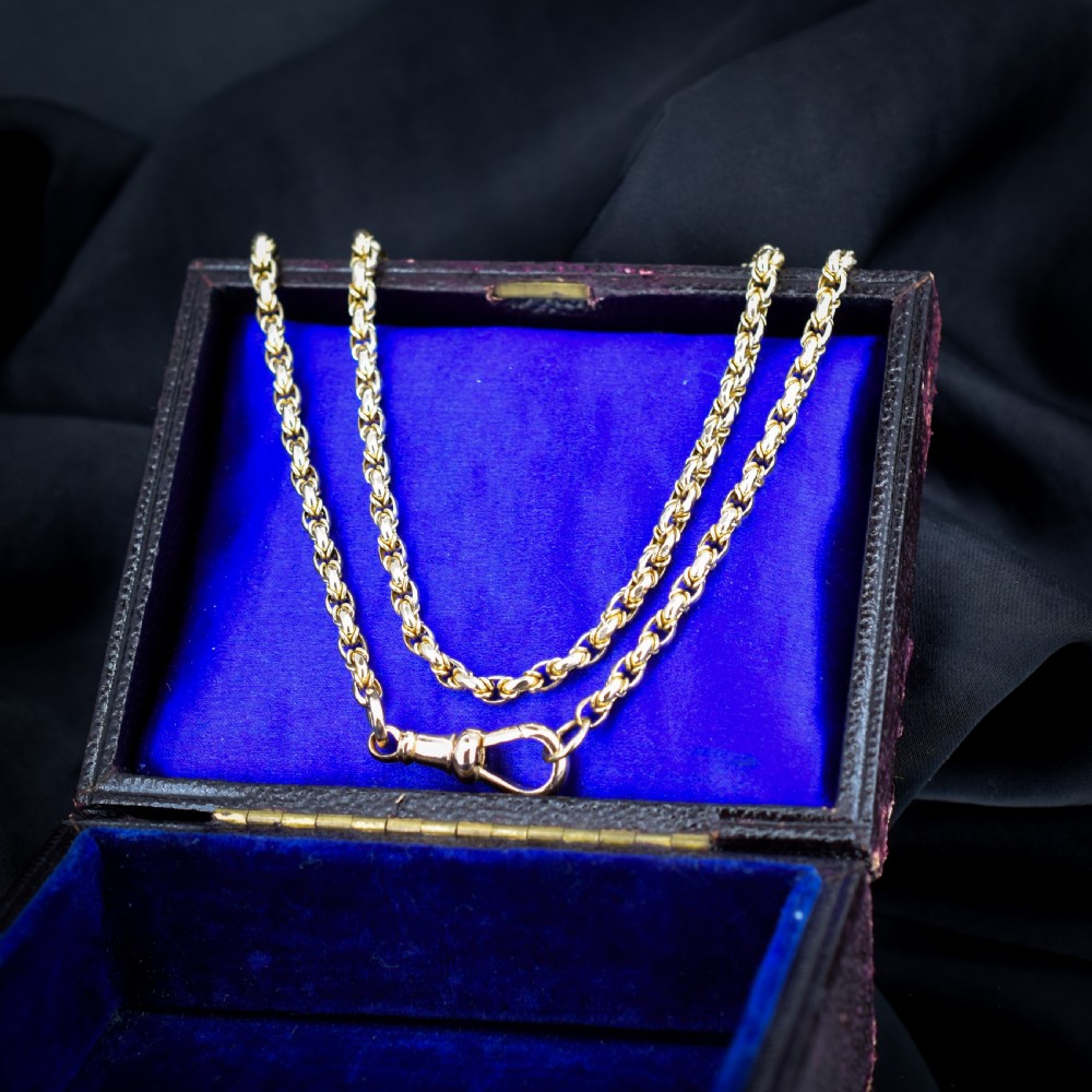 An antique 9ct yellow gold fancy link chain necklace featuring an elongated dog clip fastener.