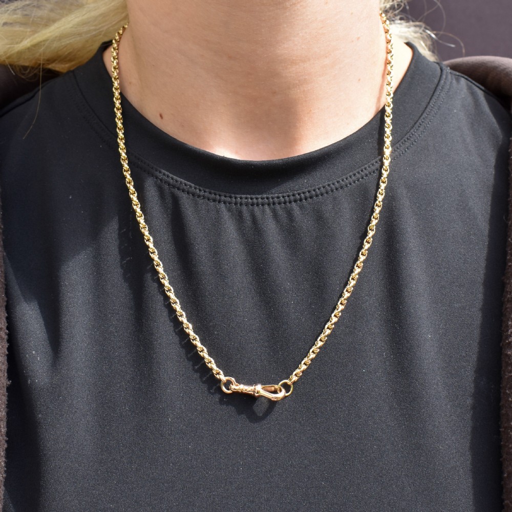An antique 9ct yellow gold fancy link chain necklace featuring an elongated dog clip fastener. View VIII