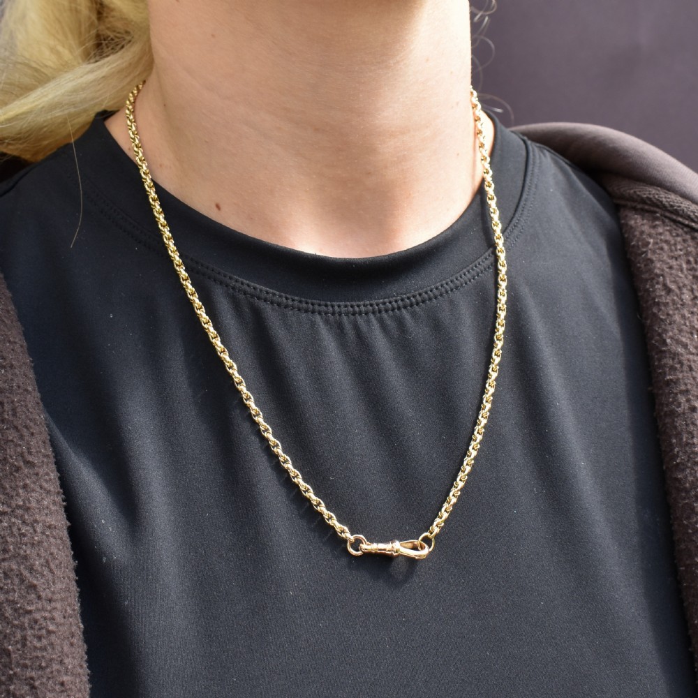 An antique 9ct yellow gold fancy link chain necklace featuring an elongated dog clip fastener. View IX