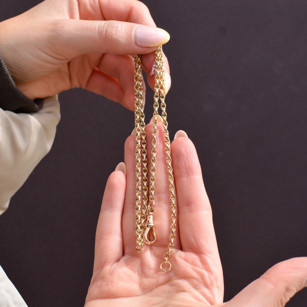 An antique 9ct yellow gold fancy link chain necklace featuring an elongated dog clip fastener. View X