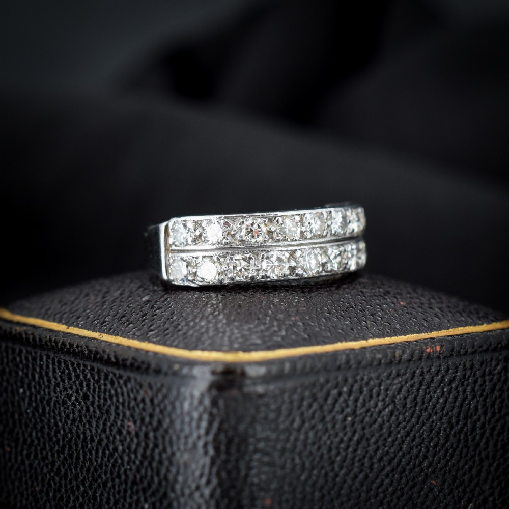 An Art Deco double row diamond half eternity ring set in 18ct white gold with channel-set round diamonds. View II