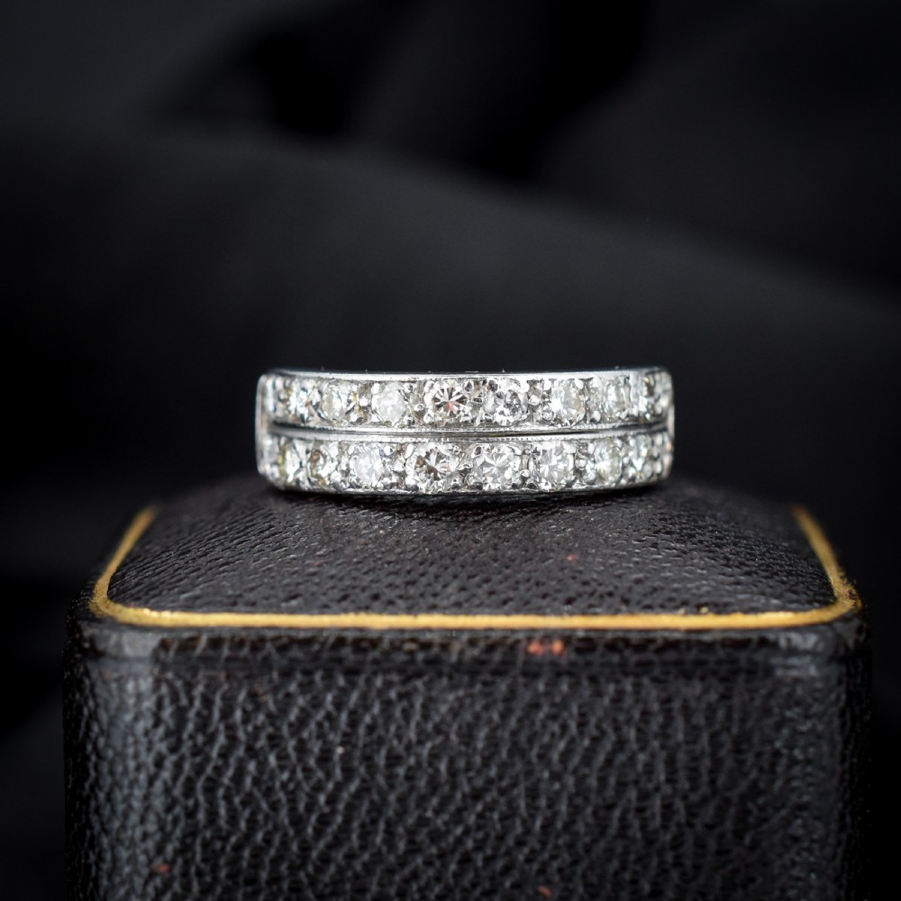 An Art Deco double row diamond half eternity ring set in 18ct white gold with channel-set round diamonds. View III