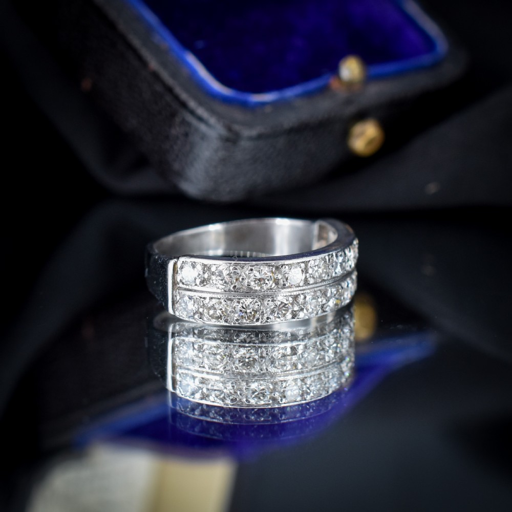 An Art Deco double row diamond half eternity ring set in 18ct white gold with channel-set round diamonds. View VII
