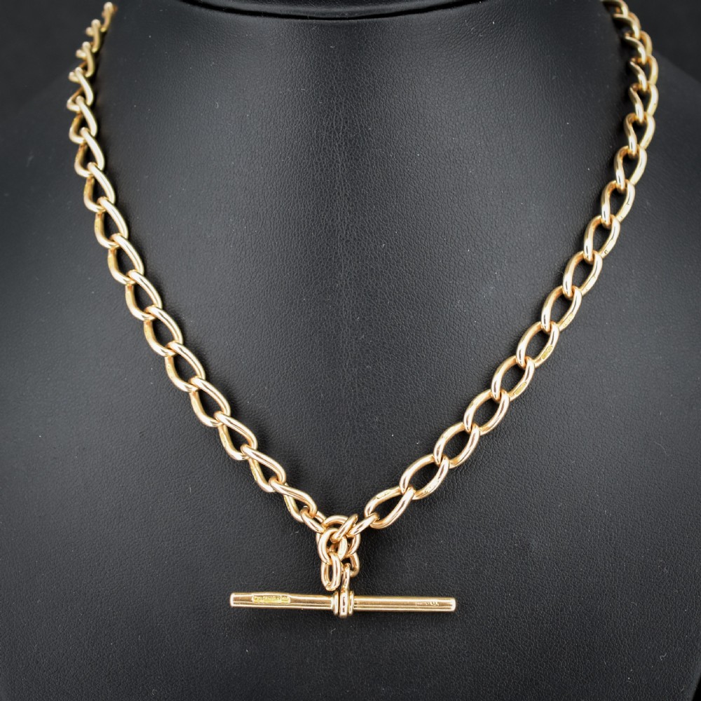 An antique 15ct yellow gold oval link Albert watch chain necklace featuring a suspended T-bar element. View II