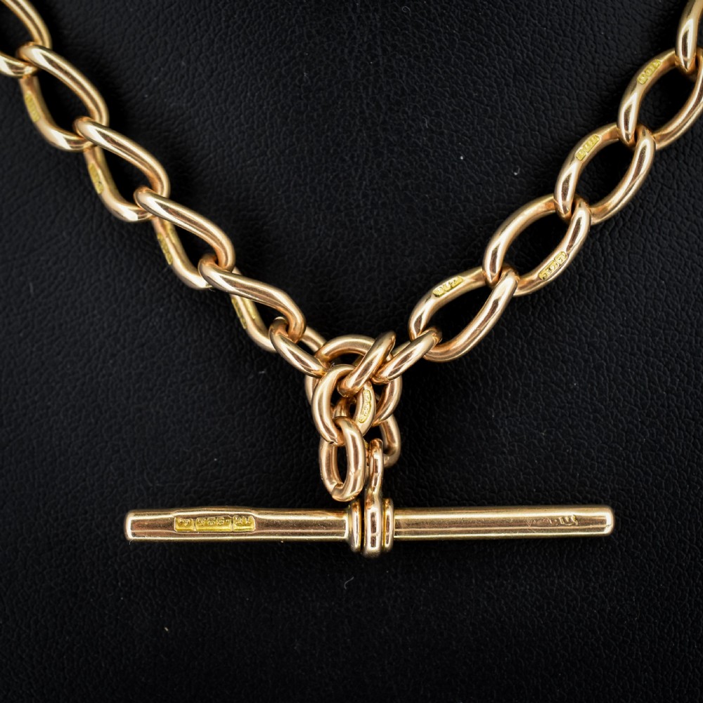 An antique 15ct yellow gold oval link Albert watch chain necklace featuring a suspended T-bar element. View III