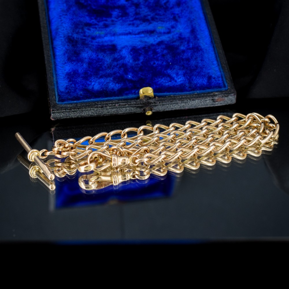 An antique 15ct yellow gold oval link Albert watch chain necklace featuring a suspended T-bar element. View VI