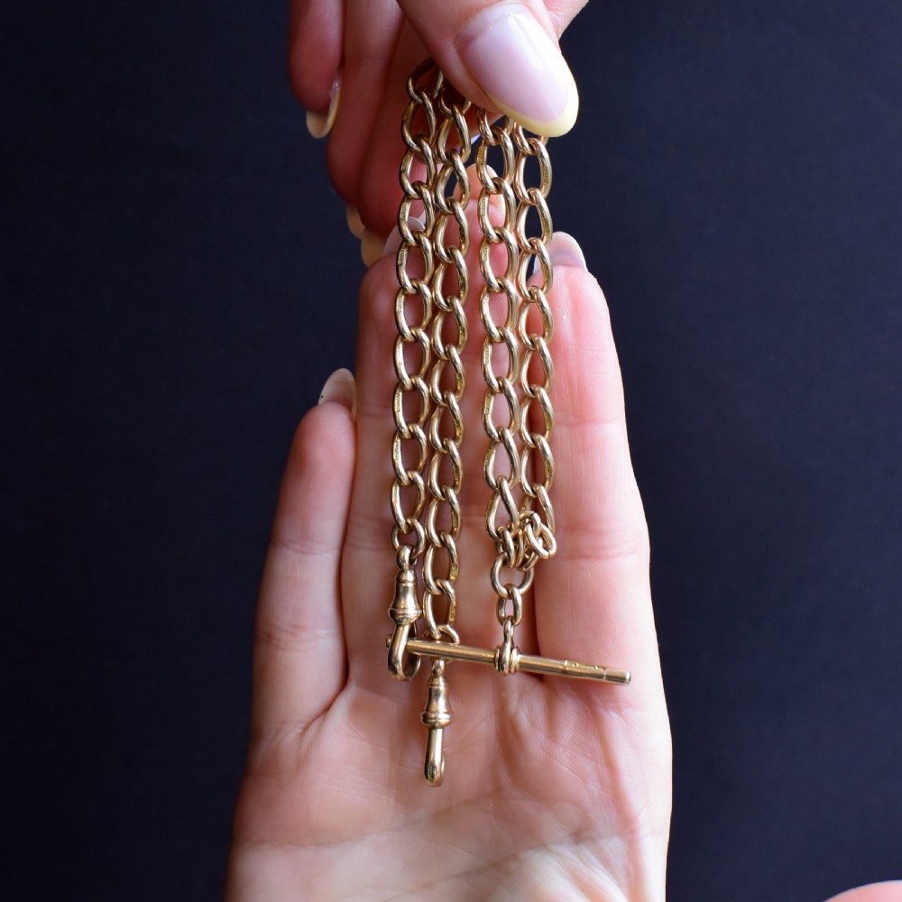 An antique 15ct yellow gold oval link Albert watch chain necklace featuring a suspended T-bar element. View X