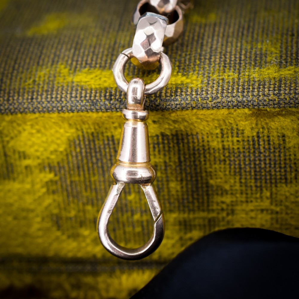 An antique 9ct gold chain bracelet featuring alternating star-and-bar decorative links and faceted round links with a swivel clasp. View VIII