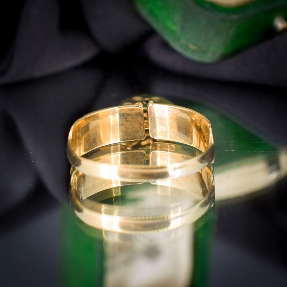 A vintage 9ct yellow gold band ring featuring relief MIZPAH lettering and a dangling heart padlock charm. View V