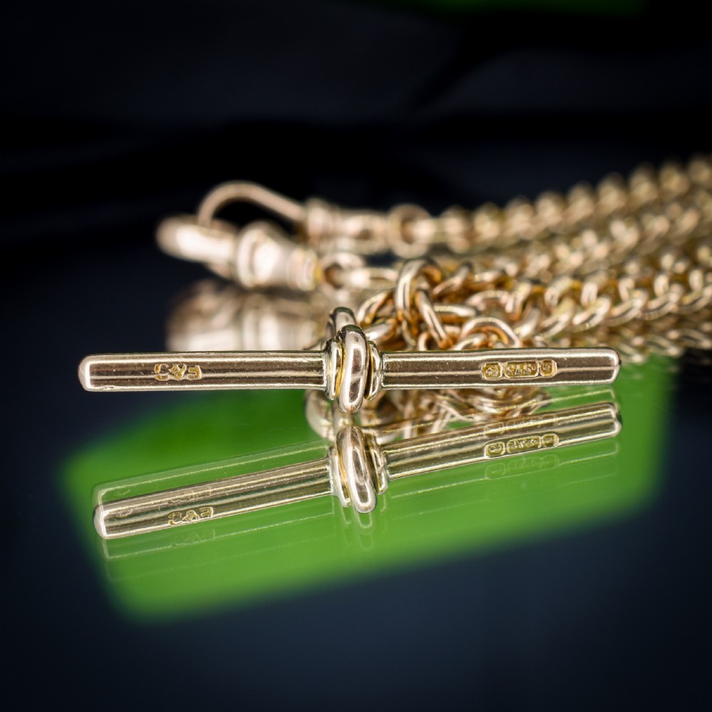 An antique 9ct yellow gold curb link Albert watch chain featuring a central T-bar drop and swivel dog clip fasteners. View III