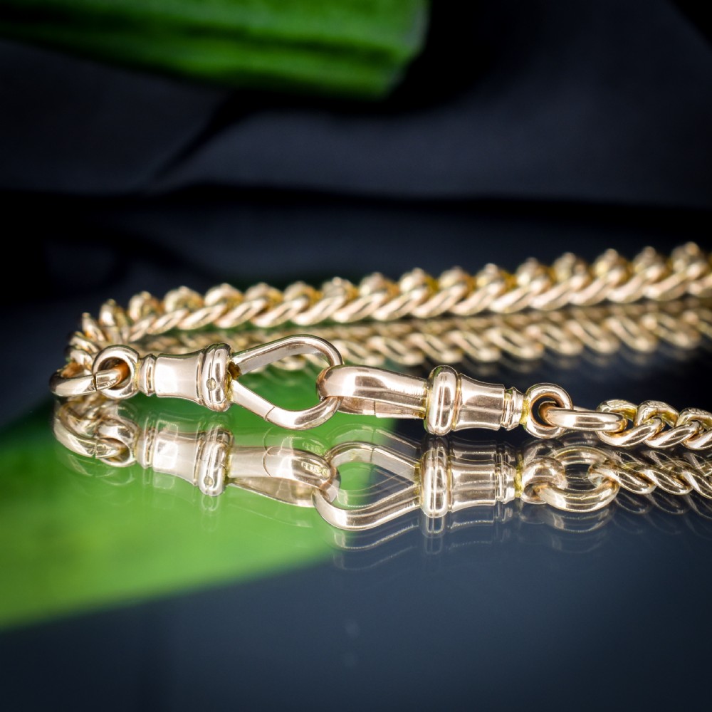 An antique 9ct yellow gold curb link Albert watch chain featuring a central T-bar drop and swivel dog clip fasteners. View IV