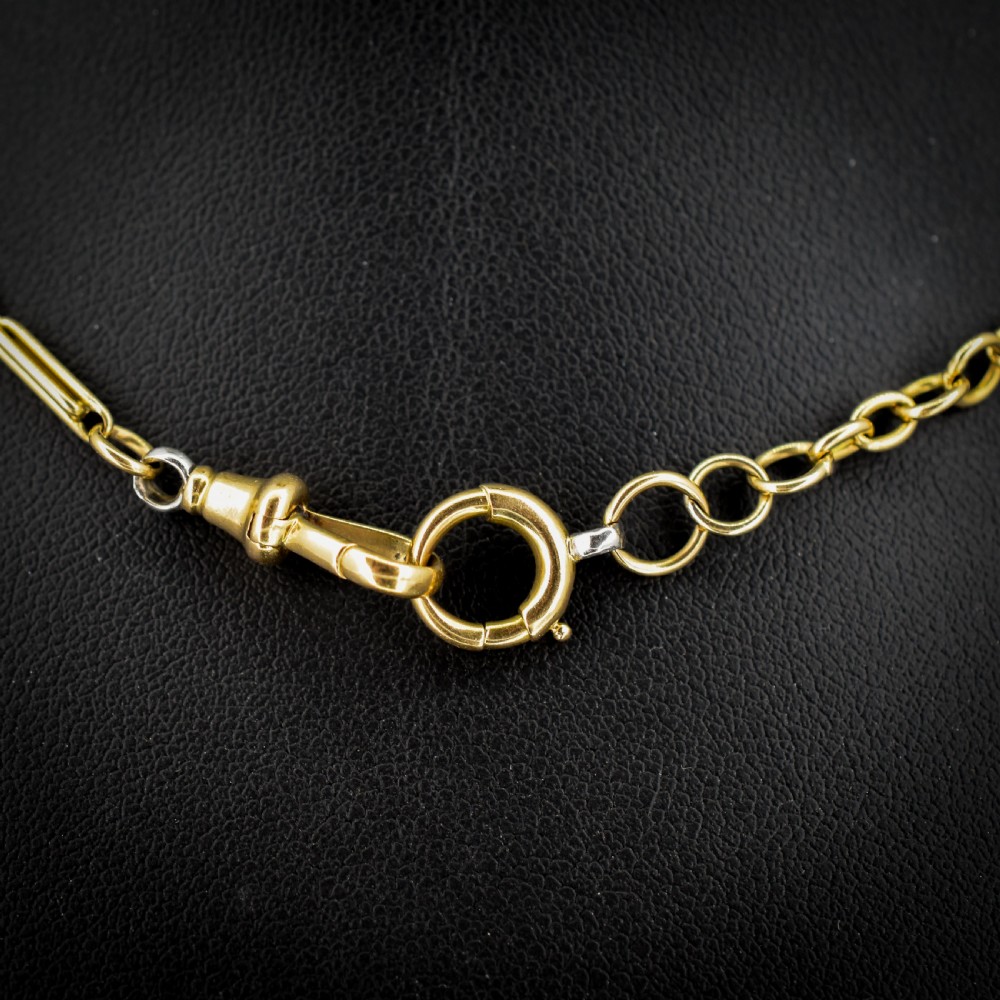 An antique two-tone chain necklace featuring alternating 18ct yellow gold and platinum elongated links with a dog clip and bolt ring clasp. View IV