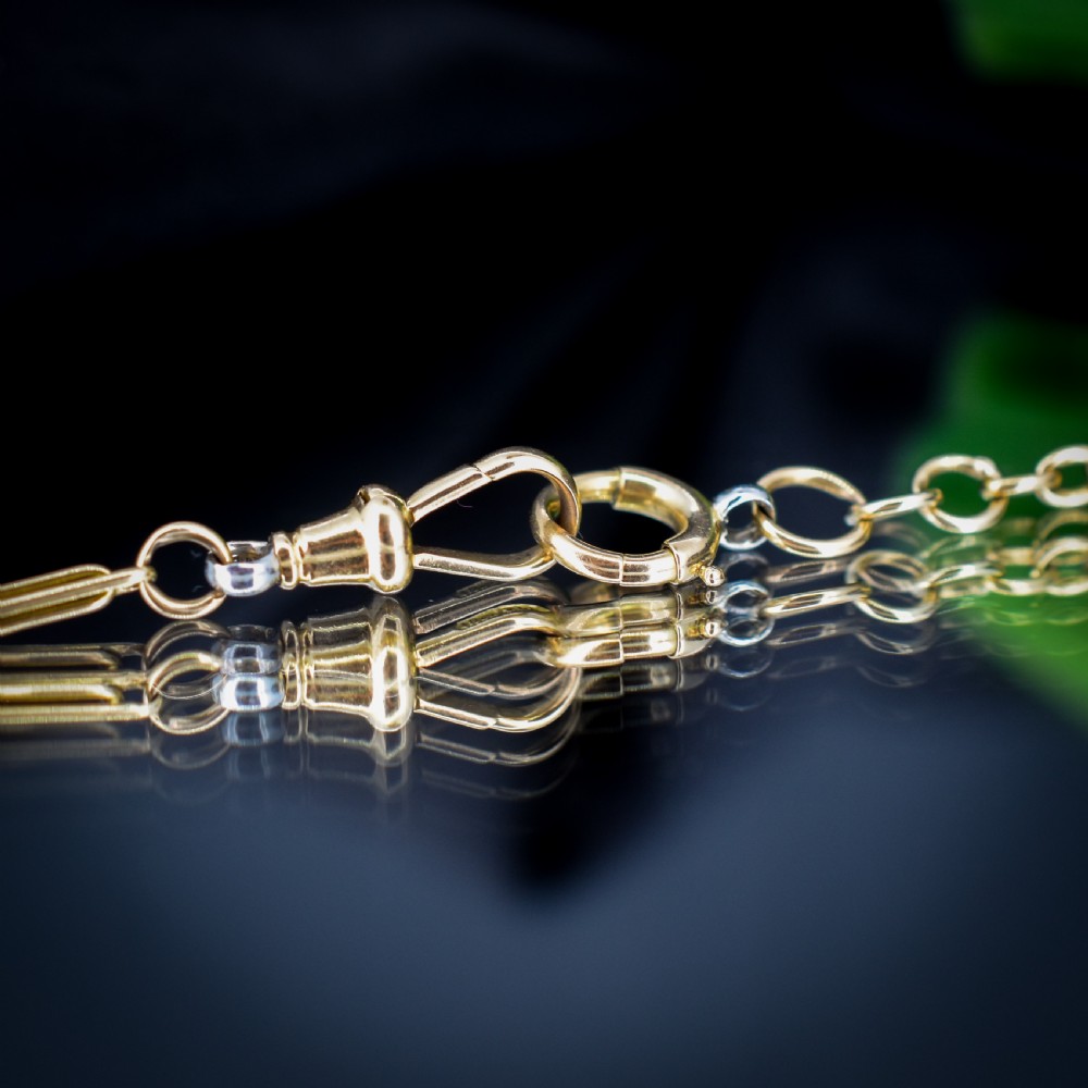 An antique two-tone chain necklace featuring alternating 18ct yellow gold and platinum elongated links with a dog clip and bolt ring clasp. View VII