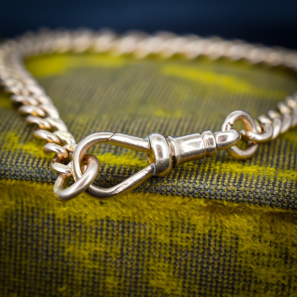 An antique 9ct yellow gold curb link chain bracelet with a swivel dog clip clasp. View II