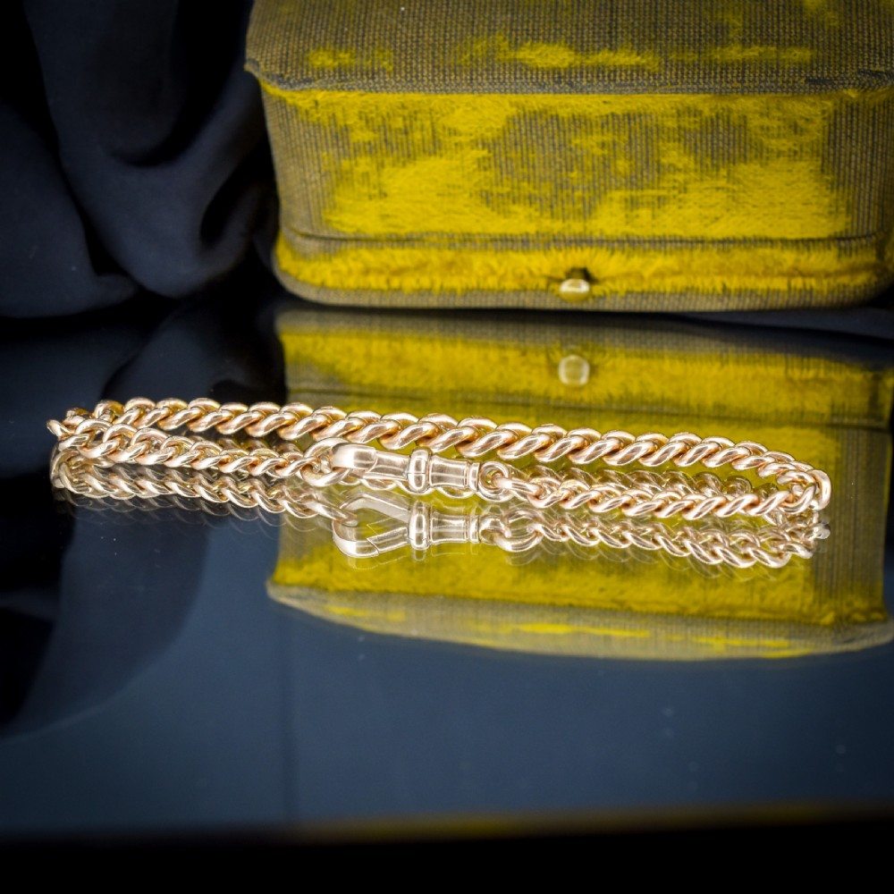An antique 9ct yellow gold curb link chain bracelet with a swivel dog clip clasp. View III